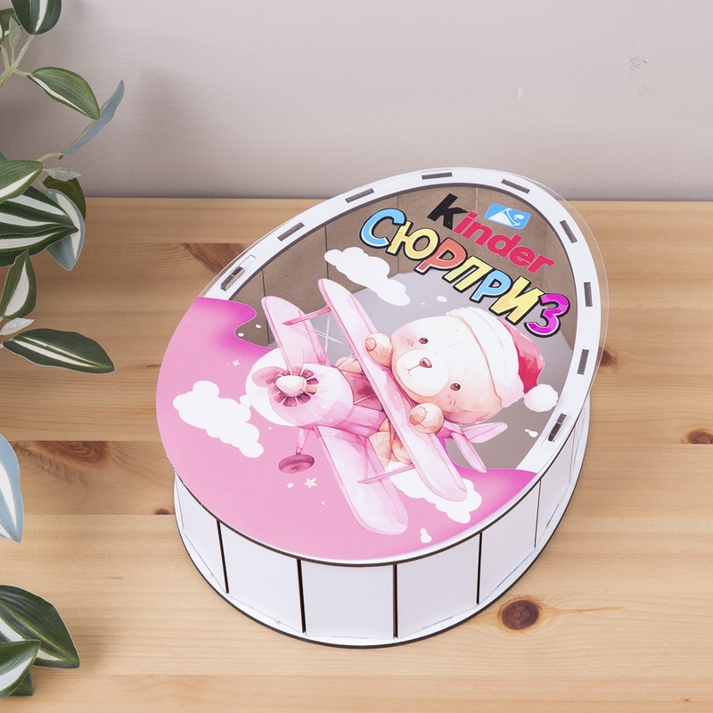 Овальна подарункова коробка Kinder біла з прозорою кришкою 25×19×7 см «Ведмедик в літачку»